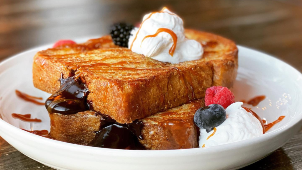 Jamies restaurant french toast with whip cream and berries 